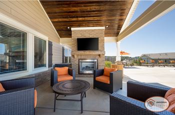 Outdoor pavilion with fireplace, flat screen tv, and food area